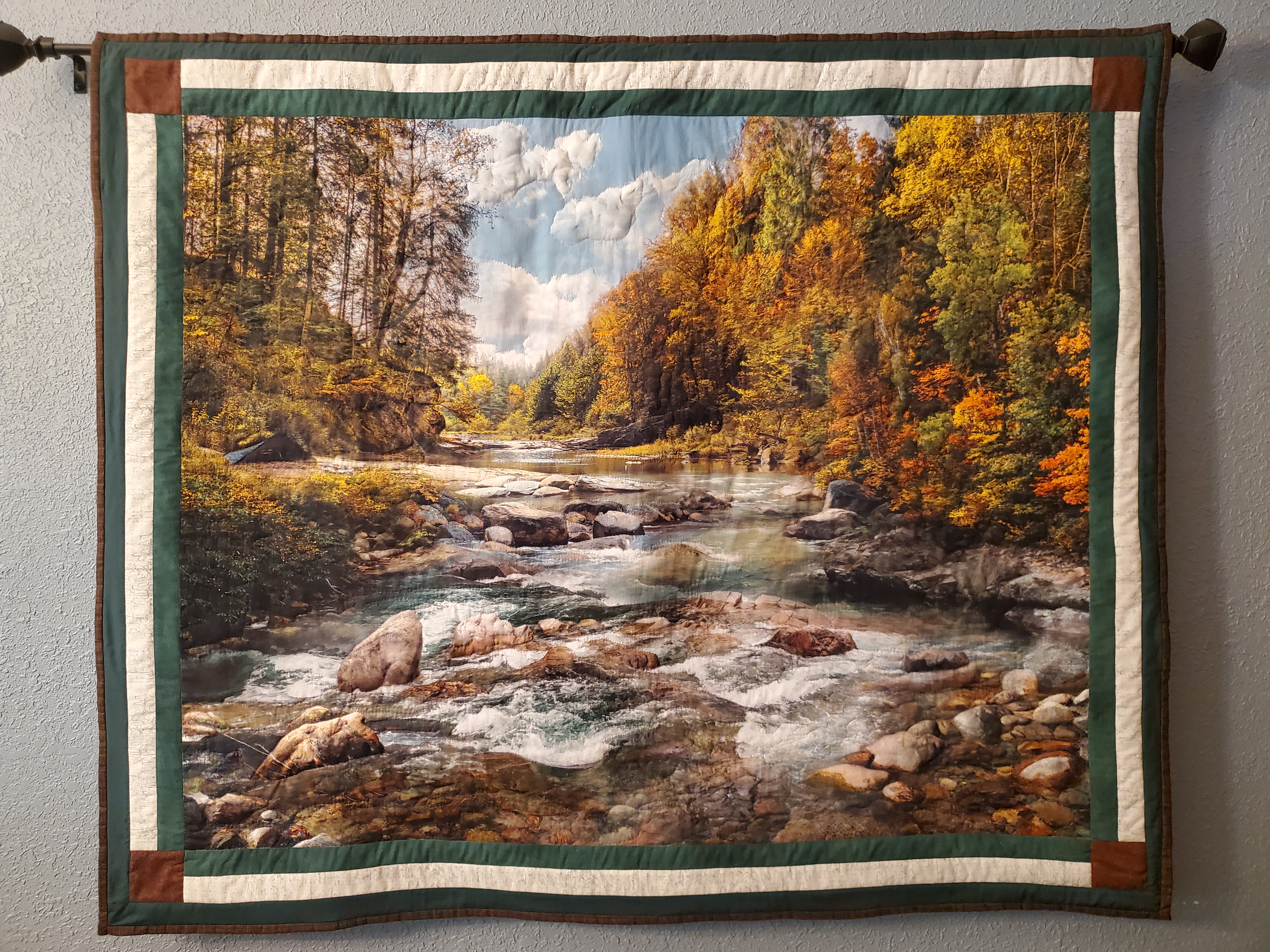 Quilt with outdoor scene.